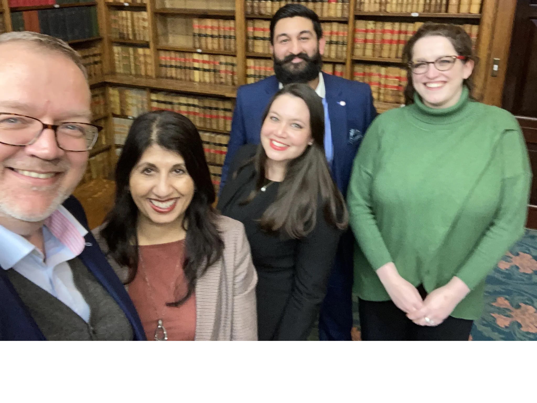 Lubna Shuja and Bal Singh Atwal, with other committee members smiling in a self group photo in European Union Library