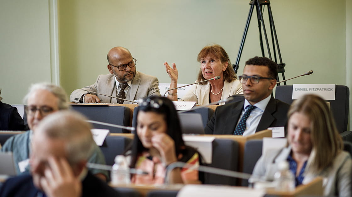 Law Society Council members discuss issues at a Council member meeting.