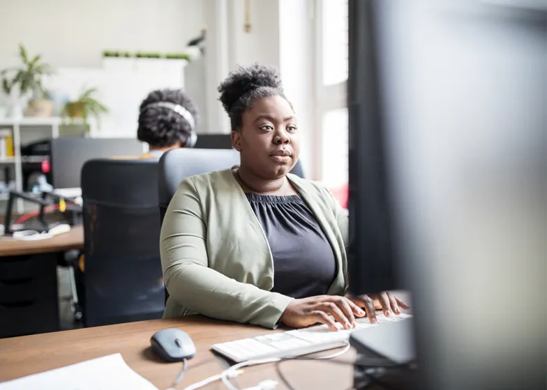 Woman working on computer in office