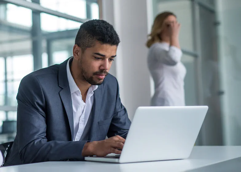 Man working on laptop in office