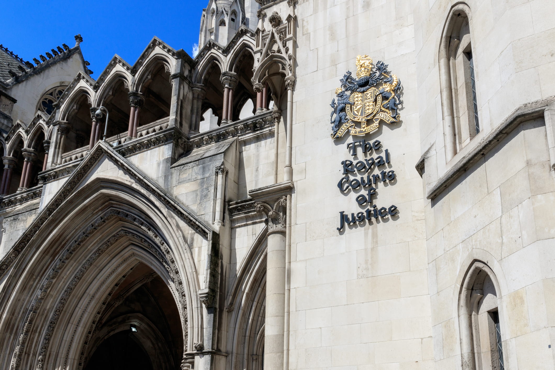 The image shows the top of the main entrance to the Royal Court of Justice in London.